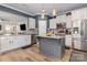 Modern kitchen features granite counters, white cabinets, an island, and stainless steel appliances at 8112 Mossy Rock Rd, Waxhaw, NC 28173