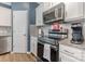 Modern kitchen boasts stainless steel appliances, granite countertops, and ample cabinet space at 8112 Mossy Rock Rd, Waxhaw, NC 28173