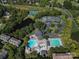 Aerial view of community amenities, including swimming pools, tennis courts, pond, and clubhouse at 9802 Sky Vista Dr, Huntersville, NC 28078