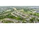 Expansive aerial view of a residential neighborhood surrounded by lush greenery and a golf course at 9802 Sky Vista Dr, Huntersville, NC 28078
