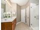 Bathroom showcasing a double sink vanity, a shower, and neutral color scheme at 9802 Sky Vista Dr, Huntersville, NC 28078