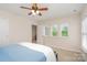 Bedroom features neutral walls, carpet flooring, ceiling fan, and natural light from multiple windows at 9802 Sky Vista Dr, Huntersville, NC 28078