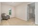 Minimalist bedroom with a chair, a neutral color palette, and a bright window at 9802 Sky Vista Dr, Huntersville, NC 28078