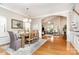 Open concept dining room featuring a hardwood floor, decorative lighting, rug and views of the living room at 9802 Sky Vista Dr, Huntersville, NC 28078
