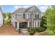 Charming two-story home with mixed brick and vinyl siding and well-maintained landscaping at 9802 Sky Vista Dr, Huntersville, NC 28078