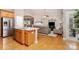 Open concept kitchen featuring stainless steel appliances and a seamless flow to the living area at 9802 Sky Vista Dr, Huntersville, NC 28078