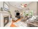 Spacious living room featuring hardwood floors, a fireplace, large windows and vaulted ceiling at 9802 Sky Vista Dr, Huntersville, NC 28078