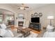 Cozy living room boasts hardwood flooring, a fireplace, vaulted ceiling, neutral color palette at 9802 Sky Vista Dr, Huntersville, NC 28078