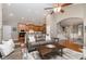 Open-concept living room with hardwood flooring, comfortable seating, and seamless flow to kitchen at 9802 Sky Vista Dr, Huntersville, NC 28078