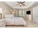 Inviting main bedroom with a tray ceiling, large windows, and neutral decor at 9802 Sky Vista Dr, Huntersville, NC 28078