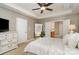 Main bedroom featuring a large mirror, neutral decor, and ensuite bathroom access at 9802 Sky Vista Dr, Huntersville, NC 28078