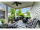 Inviting covered patio with stylish seating, lush greenery, creating a relaxing outdoor living space at 9802 Sky Vista Dr, Huntersville, NC 28078