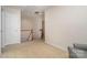 Upstairs hallway with carpet flooring and a view of the staircase and adjacent rooms at 9802 Sky Vista Dr, Huntersville, NC 28078