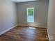 Bedroom featuring a hardwood floor and a large window overlooking the lawn at Lot 9 Lilly Pad Dr, Salisbury, NC 28146