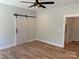 Bedroom features a barn door and a ceiling fan at Lot 9 Lilly Pad Dr, Salisbury, NC 28146