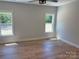 Bedroom with hardwood flooring and two large windows at Lot 9 Lilly Pad Dr, Salisbury, NC 28146