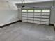 Spacious garage featuring an automatic door and a clean, concrete floor at Lot 9 Lilly Pad Dr, Salisbury, NC 28146