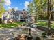 Serene backyard featuring a concrete patio, seating areas, and lush landscaping at 10009 Lattice Ct, Charlotte, NC 28269