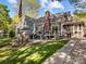 Spacious backyard featuring a patio, well-manicured lawn, outdoor furniture, and landscaping at 10009 Lattice Ct, Charlotte, NC 28269