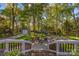 Inviting backyard oasis featuring a patio, lush greenery, and a charming storage shed at 10009 Lattice Ct, Charlotte, NC 28269