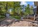 A charming backyard featuring a patio, storage shed, well-manicured lawn, and landscaping at 10009 Lattice Ct, Charlotte, NC 28269