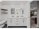 Stylish bathroom featuring a double vanity, sleek fixtures, and a view into the bedroom at 10009 Lattice Ct, Charlotte, NC 28269