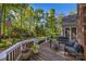 Relaxing deck area perfect for outdoor living with comfortable seating and a view of the backyard at 10009 Lattice Ct, Charlotte, NC 28269