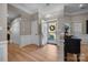 Bright foyer with hardwood floors, neutral walls, and an open doorway at 10009 Lattice Ct, Charlotte, NC 28269