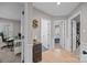Well-lit hallway with hardwood floors, multiple doorways, and stylish decor at 10009 Lattice Ct, Charlotte, NC 28269