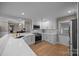 Bright kitchen with stainless steel appliances, white countertops, and updated cabinets at 10009 Lattice Ct, Charlotte, NC 28269