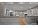 Modern white kitchen featuring stainless steel appliances and an open floor plan at 10009 Lattice Ct, Charlotte, NC 28269