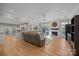Open living area with hardwood floors, a fireplace, and comfortable seating at 10009 Lattice Ct, Charlotte, NC 28269