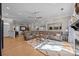 Open living area with hardwood floors, a fireplace, and comfortable seating at 10009 Lattice Ct, Charlotte, NC 28269