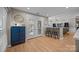 Bright living room with bar seating, a blue cabinet, and glass doors to the exterior at 10009 Lattice Ct, Charlotte, NC 28269