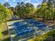 Aerial view of the two freshly painted tennis courts surrounded by a secure fence at 10009 Lattice Ct, Charlotte, NC 28269