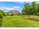 Backyard with a well-maintained lawn, patio, and lush landscaping at 10012 Royal Colony Dr, Waxhaw, NC 28173