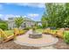 Backyard featuring a cozy fire pit area with Adirondack chairs at 10012 Royal Colony Dr, Waxhaw, NC 28173