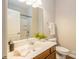 Bright bathroom features a large mirror, single sink, and shower tub combination at 10012 Royal Colony Dr, Waxhaw, NC 28173