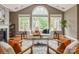 Bright living room with vaulted ceilings, large windows, fireplace, and stylish furnishings at 10012 Royal Colony Dr, Waxhaw, NC 28173