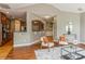 Open concept living room showcasing hardwood floors and seamless flow to the kitchen at 10012 Royal Colony Dr, Waxhaw, NC 28173