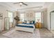 Serene bedroom features a tray ceiling, large windows, and neutral décor at 10012 Royal Colony Dr, Waxhaw, NC 28173