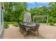 Outdoor patio with table, chairs, and an umbrella at 10012 Royal Colony Dr, Waxhaw, NC 28173
