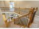 Elegant staircase with wooden railings and wrought iron spindles, offering a grand entrance at 10012 Royal Colony Dr, Waxhaw, NC 28173