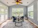 Cozy sun room with vaulted ceiling, lots of windows, and comfortable seating at 10012 Royal Colony Dr, Waxhaw, NC 28173