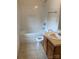Bathroom featuring linoleum flooring, a shower-tub combo, a white toilet, and a vanity with a sink at 1012 Kings Mountain Ln, Gastonia, NC 28054