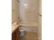 Bathroom featuring linoleum flooring, a shower-tub combo, a white toilet, and a vanity with a sink at 1012 Kings Mountain Ln, Gastonia, NC 28054