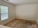Bedroom with neutral paint, carpeted floor and natural light from the window at 1012 Kings Mountain Ln, Gastonia, NC 28054