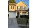 Charming two-story home features a front-facing garage and a welcoming front porch with dark green door and shutters at 1012 Kings Mountain Ln, Gastonia, NC 28054