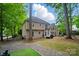Expansive backyard featuring a patio, mature trees, and a fenced yard for outdoor enjoyment and privacy at 10319 Remembrance Trl, Huntersville, NC 28078