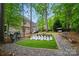 Beautiful backyard featuring a unique chess set and outdoor seating, perfect for relaxing and entertaining at 10319 Remembrance Trl, Huntersville, NC 28078